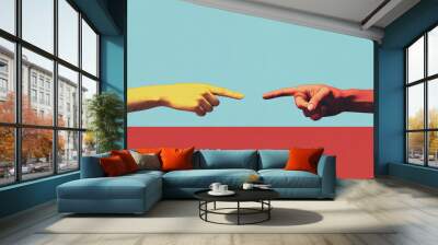 The image shows two hands, one yellow and one red, pointing towards each other over a bold, contrasting background of blue and red. Wall mural