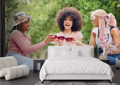 Black woman, cocktail and friends relax on picnic for peace, wellness and friendship reunion with alcohol glass drink. Nature park, trees and happy gen z people bonding, having outdoor fun and smile Wall mural