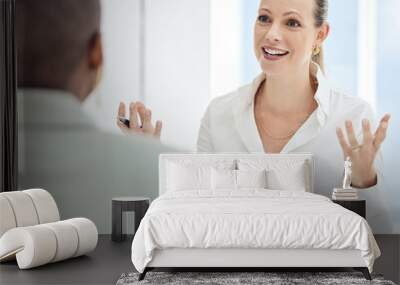 Communication, planning and employees in a meeting, interview or partnership for business in office at work. Happy, smile and manager talking to a worker about a strategy for marketing at the company Wall mural