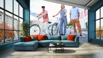 Friends, bike and skateboard standing on urban city road together. Portrait of trendy, young men and woman model street edgy fashion, lifestyle and youth or teenage outdoors sport activity Wall mural