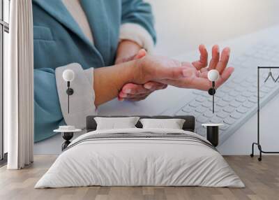 Business woman, hands and wrist pain from carpal tunnel syndrome, typing or injury on office desk. Closeup of female person with sore arm, inflammation or discomfort and joint ache at the workplace Wall mural