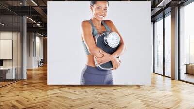 Diet, portrait and scale with a black woman athlete in studio on a gray background for body positivity or health. Fitness, weightloss and losing weight with a young female posing for wellness Wall mural