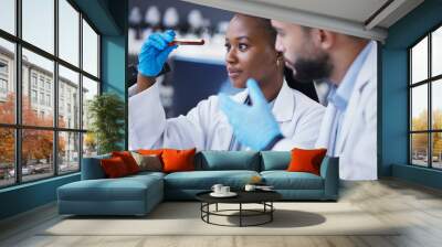 Science, collaboration and scientists with a blood test in a lab working on a experiment, test or exam. Medical, pharmaceutical and team of researchers doing scientific dna research in a laboratory. Wall mural