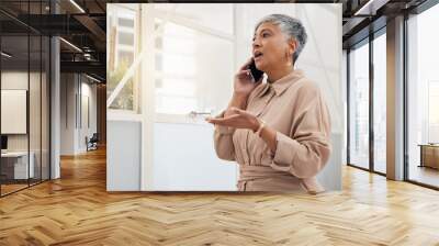 Senior woman, phone call and networking in a office with a smile and mobile conversation for work. Person, female professional and discussion from contact and communication for business online Wall mural