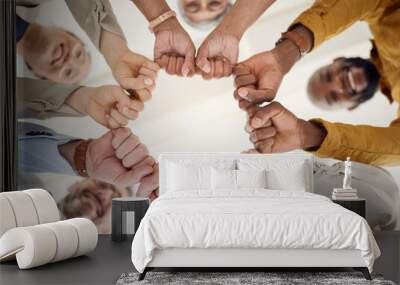 Team building, fist bump and business people portrait in office for teamwork, support or faith from below. Diversity, hands and team face together sign for union, trust and partnership or motivation Wall mural