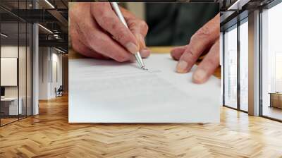 Sign, retirement and will for old man, home and agreement of inheritance and planning. House, closeup and paperwork with lawyer, decision and legal for assets of elderly person with pen for property Wall mural