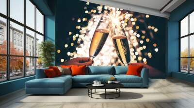 Glasses of champagne and fireworks at new years eve or christmas celebration Wall mural