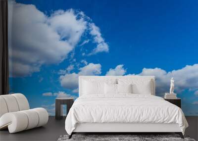 group of white cumulus clouds in the blue sky as a natural background Wall mural