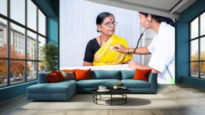 doctor examining health of senior sick patient at hospital - concept of treatment, routine checkup and healthcare. Wall mural