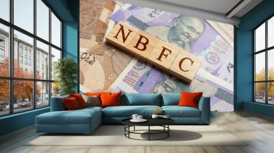 NBFC in wooden block letters on indian currency Wall mural