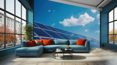 A solar panel is on a roof with a blue sky and clouds in the background Wall mural