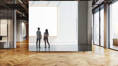 Two people standing in front of a large white wall Wall mural