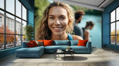 a young happy blond woman with her friends at a river in nature in the mountains in summer, fictional place and people. Generative AI Wall mural