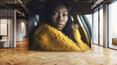 disappointed or sad  or thoughtful,, african american woman sits in a car, young adult woman, front view, close-up, multiracial female woman, fictional place Wall mural