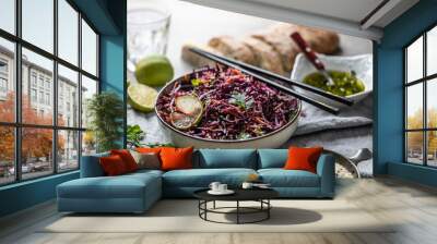 Asian red cabbage and carrot salad seasoned with coriander and sesame Wall mural