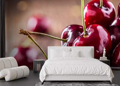 Cherries. Fresh sweet cherries. Delicious cherries with water drops in retro bowl on old oak table. Wall mural