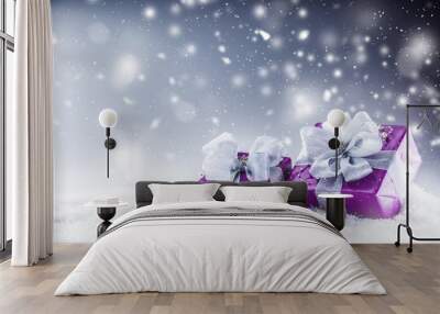 Christmas luxury purple gifts in snow and abstract snowy atmosphere Wall mural