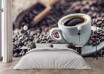 Cup of black coffee with beans on wooden table Wall mural