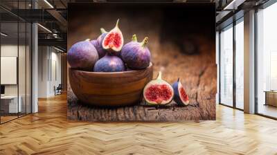 Figs. A few figs in a bowl on an old wooden background Wall mural