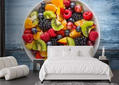 Fruit fresh mixed tropical fruit salad. Bowl of healthy fresh fruit salad - died and fitness concept. Wall mural