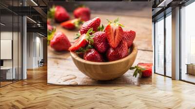 Juicy washed strawberries in wooden bowl on kitchen table Wall mural