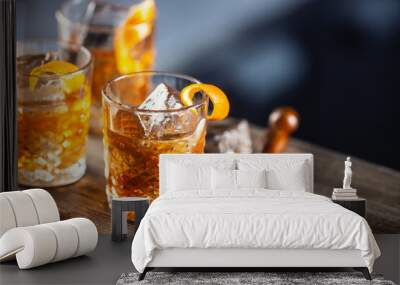 Old fashioned rum drink on ice with orange zest garnish Wall mural