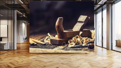 Old planer and other vintage carpenter tools in a carpentry workshop Wall mural