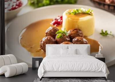 Plate serving Swedish meatballs kottbullar in sauce with mashed potatoes and cranberry sauce Wall mural