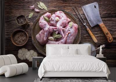 Rabbit. Raw rabbit slices with spices garlic kitchen utensil,fork and butcher. Hunting cuisine. Wall mural