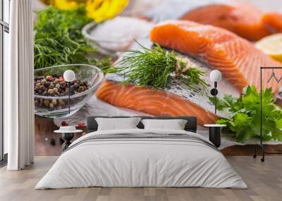 Raw salmon fillet with dill lemon olive oil salt and pepper Wall mural