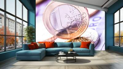 Several 500 euro banknotes and coins are adjacent. Symbolic phot Wall mural