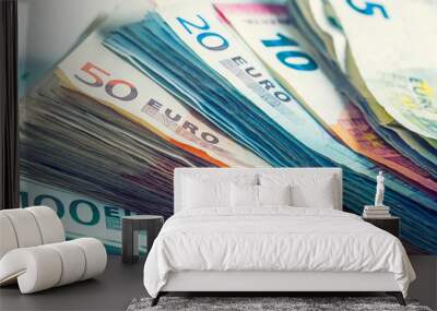 Several hundred euro  banknotes stacked by value. Euro money con Wall mural