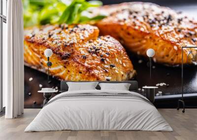 Two salmon fillets baked until crispy with sesame - Close up Wall mural