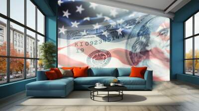 USA flag and American dollars. American flag blowing in the  wind and 100 dollars banknotes in the background. Wall mural