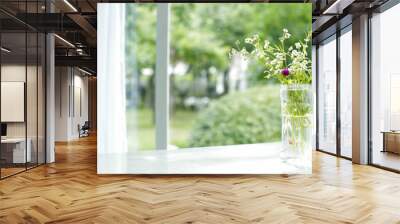 Beautiful bouquet in vase decorated near window, green yard background Wall mural