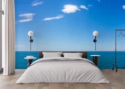 Blue sea under the blue sky and white clouds, beautiful natural scenery Wall mural