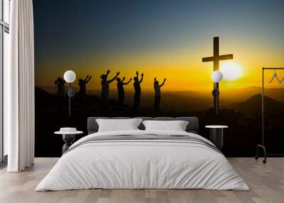 Christians praying for patients with coronavirus against sunset and cross Wall mural