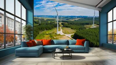 Aerial drone view of turbines at a large onshore windfarm on a green hillside (Pen y Cymoedd, Wales) Wall mural