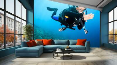 Happy SCUBA diver on a coral reef Wall mural