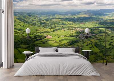 Panoramic aerial view of green farmland and fields in the rural Welsh countryside Wall mural