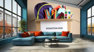 donation box with school stationery items Wall mural