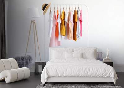 fashionable clothes on a rack in the interior of a bright room
 Wall mural