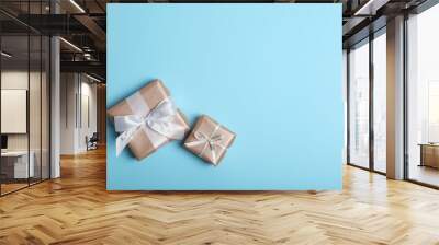 Gifts in gold packaging on a colored background with place for text top view. birthday, christmas, new year, mother's day, march 8, valentines day Wall mural