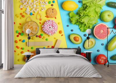 healthy foods and unhealthy foods on a colored background close-up top view. Wall mural