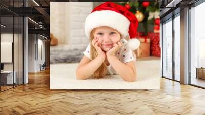 Little girl with christmas gifts in christmas interior
 Wall mural