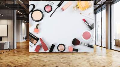 professional makeup tools. Makeup products on plain background top view. A set of various items for makeup. Wall mural