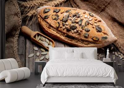 Freshly baked traditional bread on wooden table. Wall mural