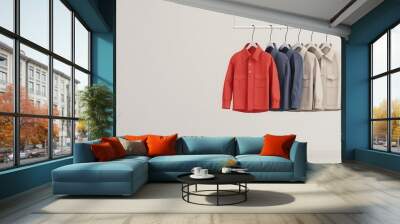 Colorful Shirts Hanging on a Minimalist Display Wall mural