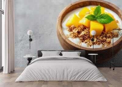 Minimalist setup with yogurt, granola, and fresh mango slices in a wooden bowl, soft daylight, focus on vibrant colors and textures, tropical freshness. Wall mural