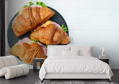 Croissant sandwich with salad ham and cheese . Top view Wall mural